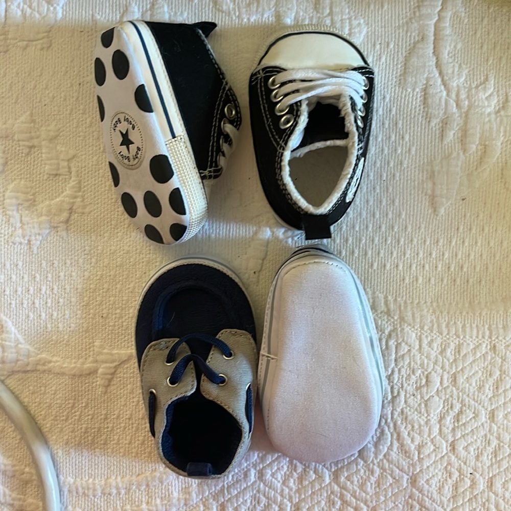 Two pairs of baby shoes.